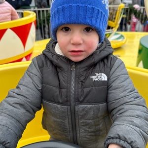 The North Face kids reversible black and gray water repellent coat